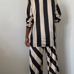 black and tan striped satin wide leg pant set with matching oversized button up shirt