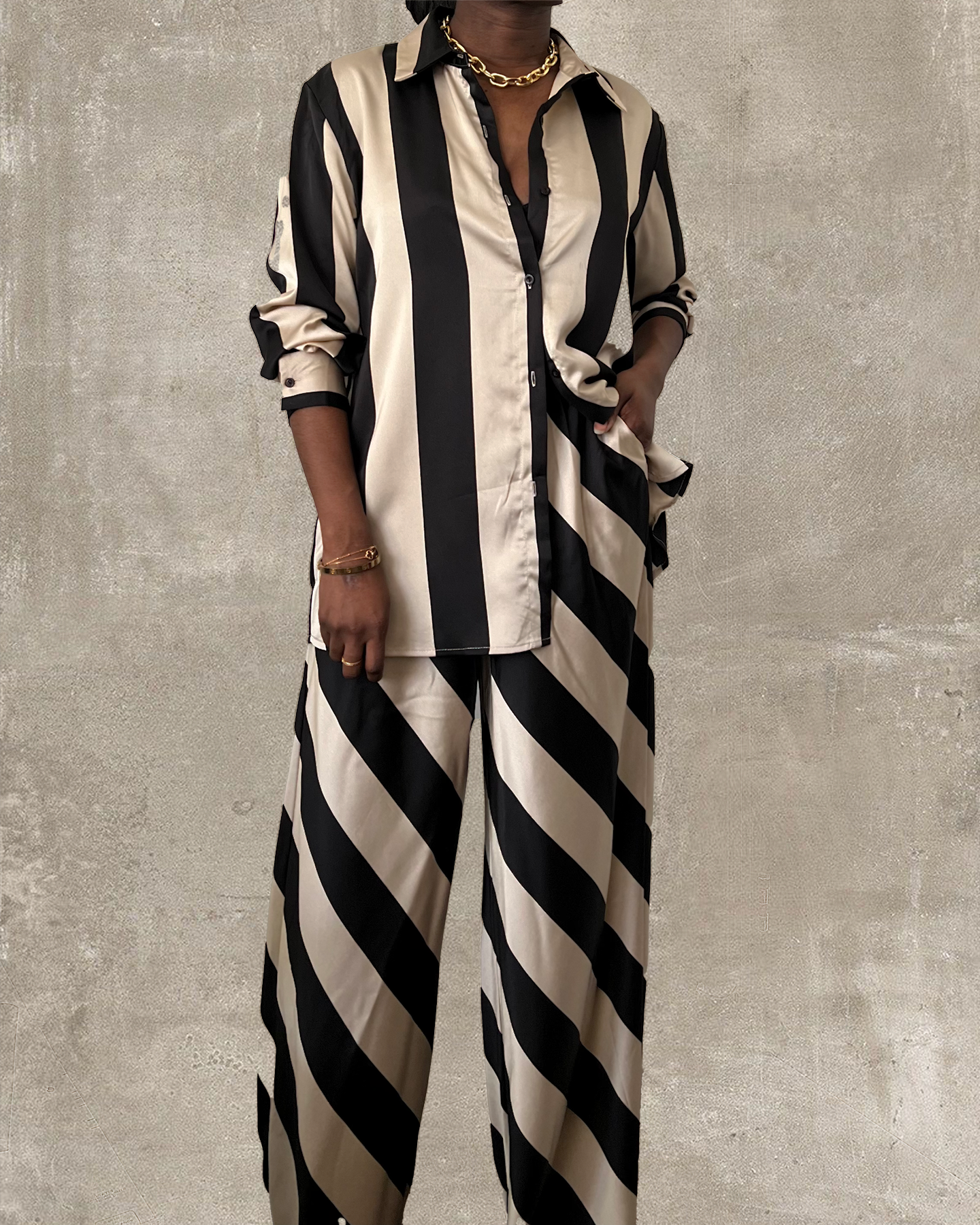 black and tan striped satin wide leg pant set with matching oversized button up shirt