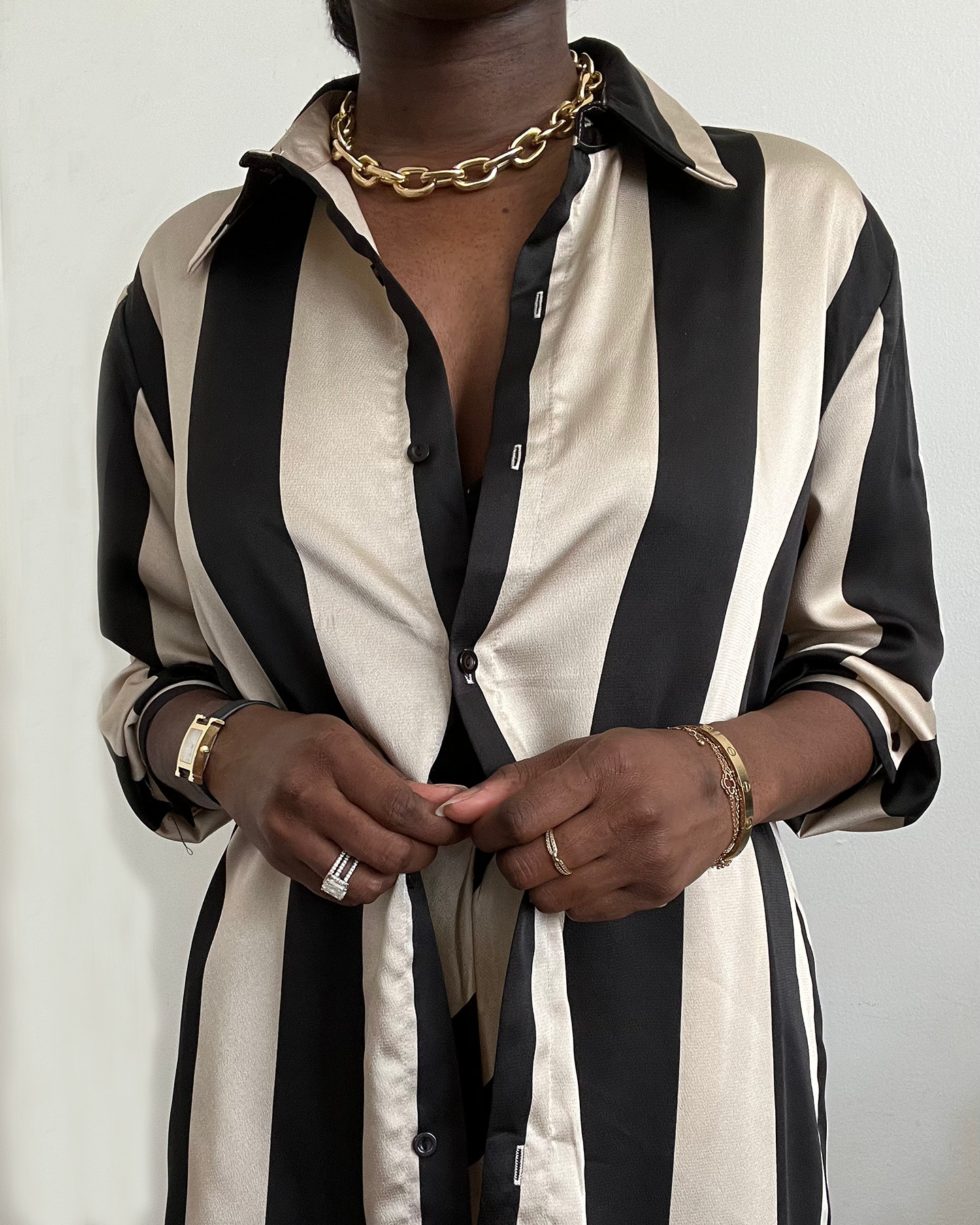 black and tan striped satin wide leg pant set with matching oversized button up shirt