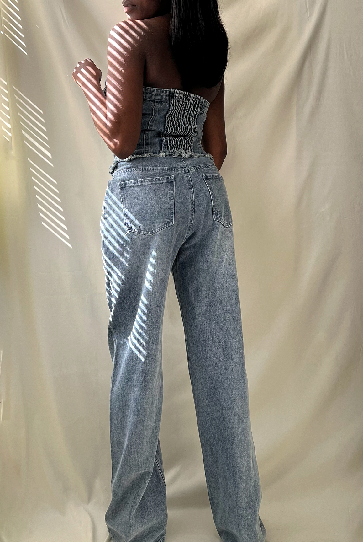 blue denim strapless button up wide leg jumpsuit