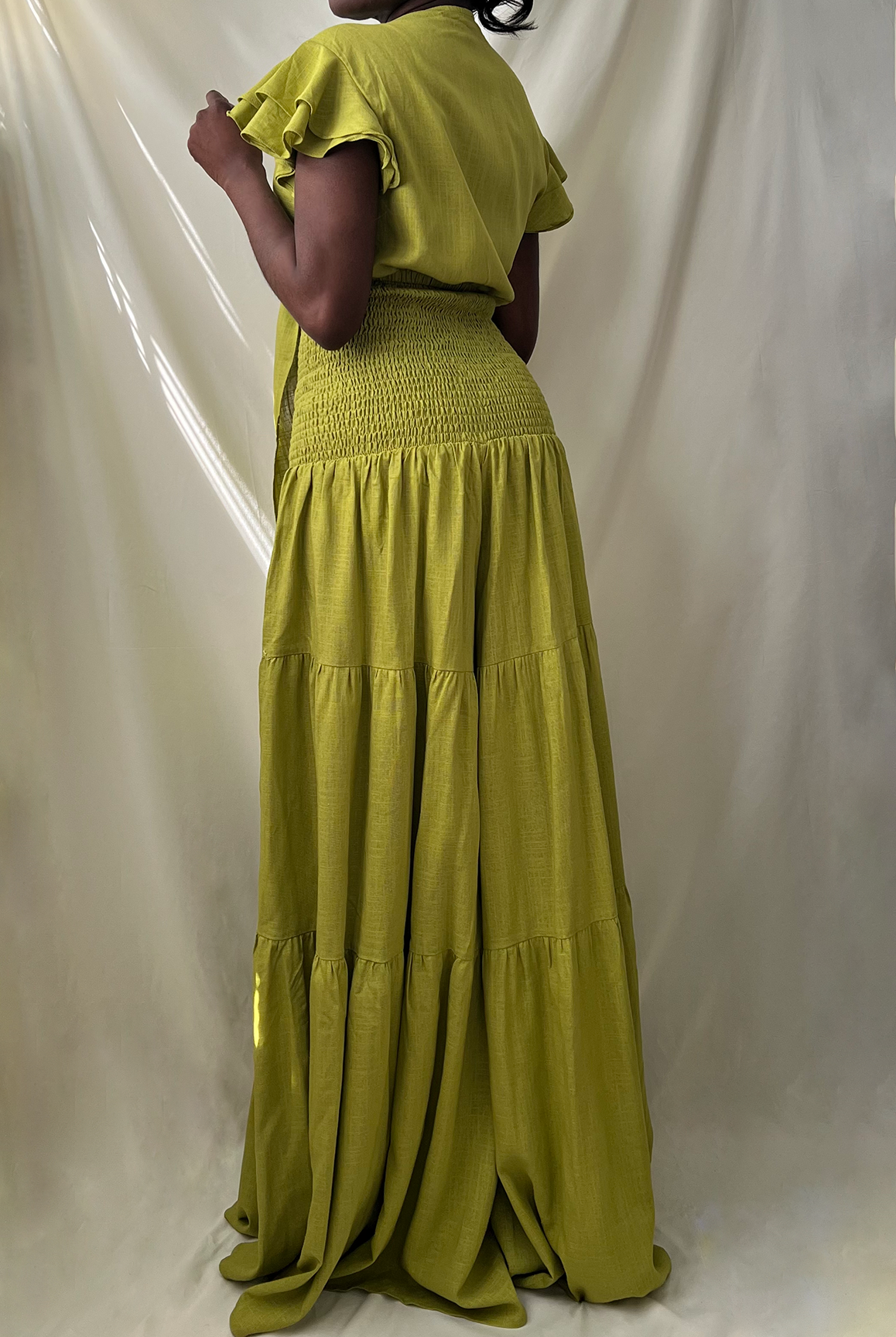 green tie front ruffle crop top with smocked tiered high waist wide leg pant set