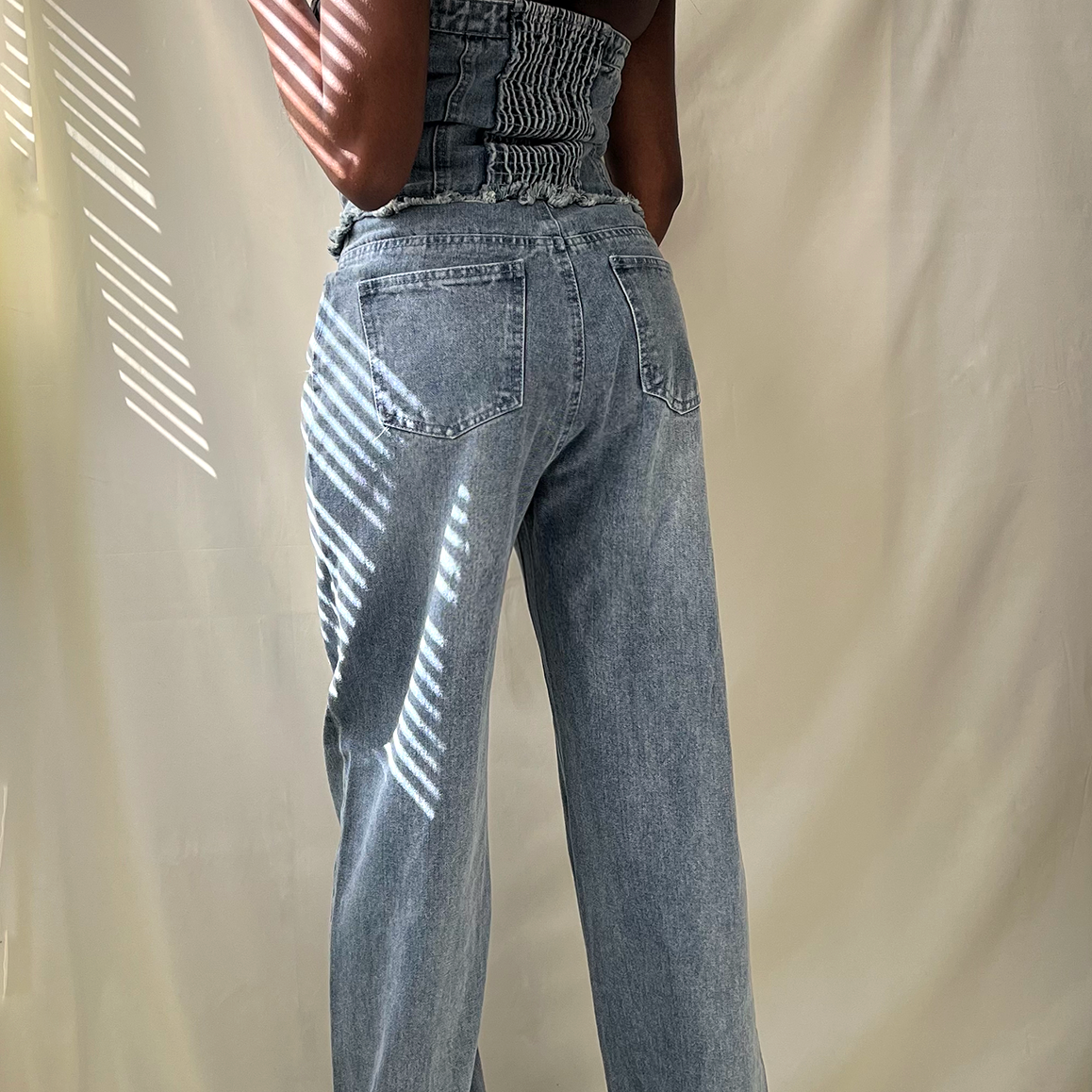 blue denim strapless button up wide leg jumpsuit